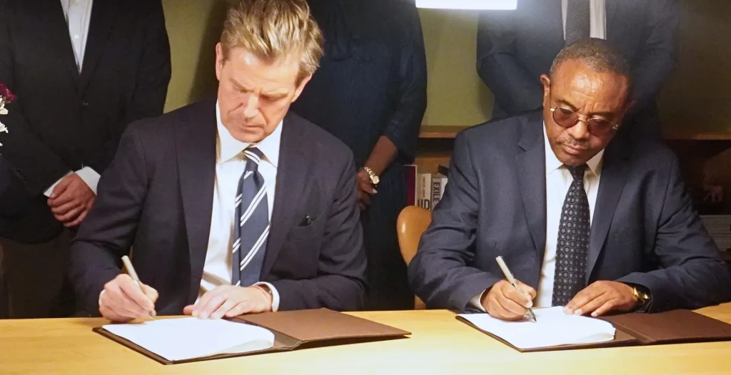 TMA Board Chair and former Prime Minister of Ethiopia, H.E. Hailemariam Desalegn Boshe, and the Danish Ambassador to Kenya, H.E. Stephan Schønemann, sign the agreement.